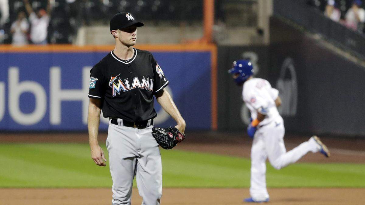 Miami Marlins starting pitcher Trevor Richards, right, reacts as New York Mets’ Amed Rosario runs the bases after hitting a three-run home run during the fourth inning of a baseball game Wednesday, Sept. 12, 2018, in New York.