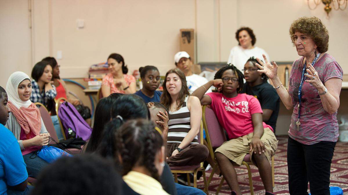 Roberta Shevin, the former executive director at MCCJ, leads a discussion on cross-cultural tolerance during a 2012 session of the MetroTown summer camp at St. Thomas University in Miami Gardens. The six-day camp provides teens with anti-prejudice training, as well as lessons on civic engagement and conflict resolution.