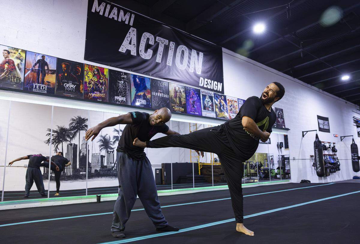 Ekandem Essiet, 41, left, and Jalen Dominguez, 26, run drills during a training session at their gym on Tuesday, Aug. 12, 2025, in Miami, Fla. Miami Action Design is the first stunt gym in Miami-Dade County and offers classes that teach members how to become stunt performers for movies and television.
