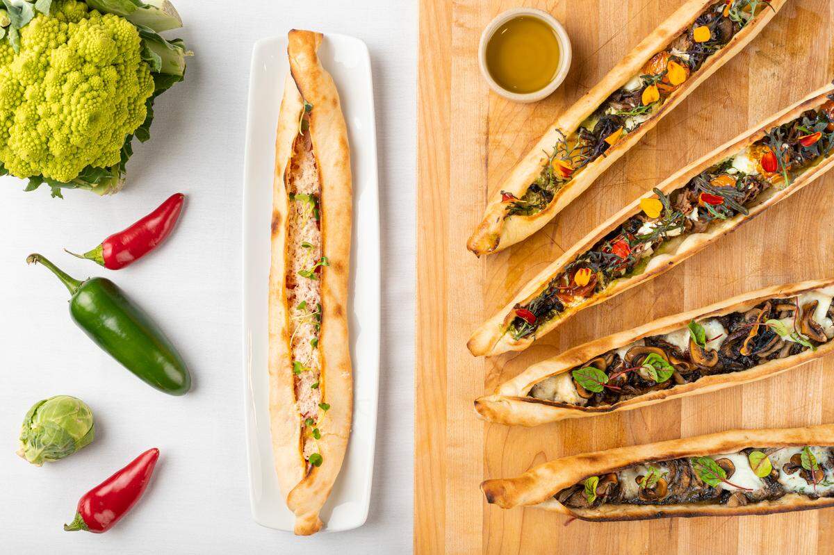 Pides are Turkish flat breads stuffed with meat or vegetables, cooked in a stone oven.