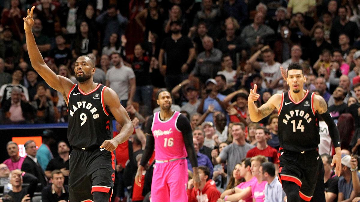 Heat forward James Johnson reacts after Raptors’ forward Serge Ibaka and guard Danny Green celebrate Green’s three pointer to increase their lead with few seconds left in the fourth quarter of the Miami Heat vs Toronto Raptors at AmericanAirlines Arena in Miami on Wednesday, December 26, 2018.