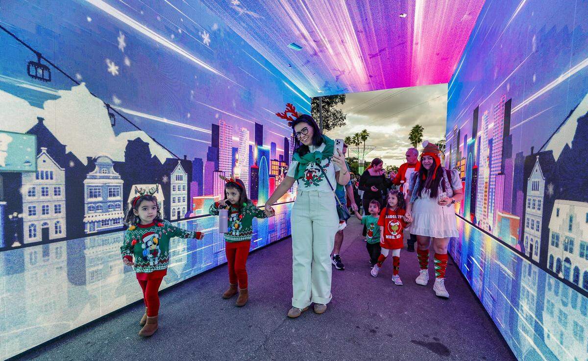 Families arrive for opening night at Christmas Wonderland at Tropical Park, a Miami-style holiday celebration of flavor and culture in Miami, Florida on Thursday, November 13, 2025.