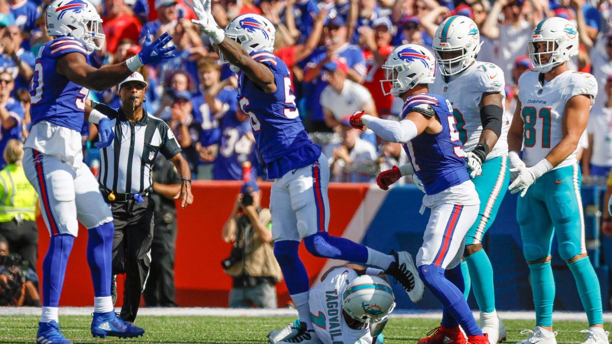 Miami Dolphins quarterback Tua Tagovailoa (1) is sacked by Buffalo Bills defensive end Greg Rousseau (50) and defensive end Leonard Floyd (56) in the first half at Highmark Stadium in Orchard Park, NY., on Sunday, October 1, 2023.