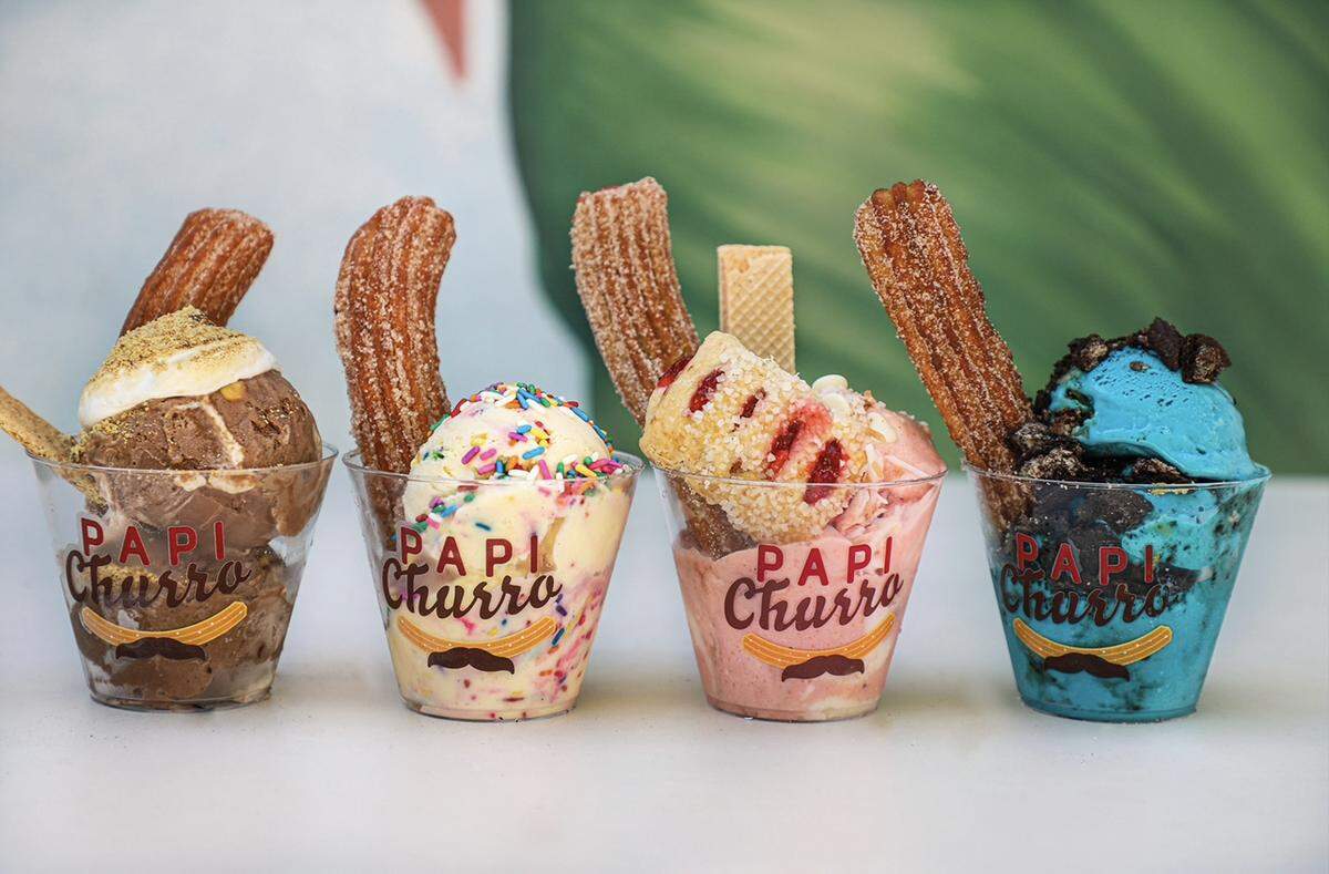 Ice cream and churro sundaes from Papi Churro. Blue Cookie Monster ice cream, at right, was created especially for Papi Churro by Frice Ice Cream.