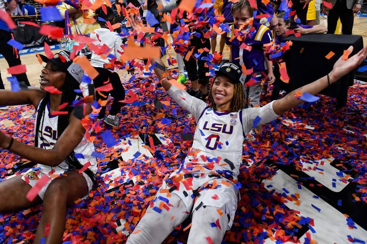 Louisiana State University forward Amani Bartlett (23) and Louisiana State University forward LaDazhia Williams (0) play in confetti on the court after winning the NCAA Women’s Greenville Regional Elite Eight Basketball Tournament at Bon Secours Wellness Arena in Greenville, S.C. Sunday, March 26, 2023. Elite Eight Round Of The Ncaa Women S Tournament