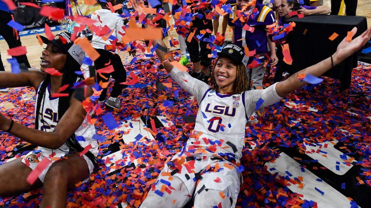 Louisiana State University forward Amani Bartlett (23) and Louisiana State University forward LaDazhia Williams (0) play in confetti on the court after winning the NCAA Women’s Greenville Regional Elite Eight Basketball Tournament at Bon Secours Wellness Arena in Greenville, S.C. Sunday, March 26, 2023. Elite Eight Round Of The Ncaa Women S Tournament