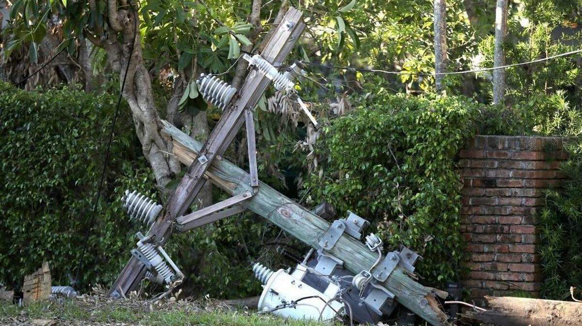 A downed utility pole lies on the ground in Coral Gables on Sept. 16, 2017, following Hurricane Irma.