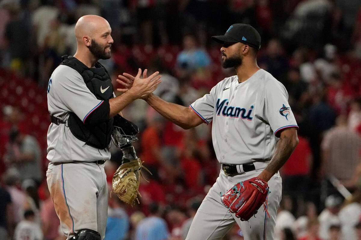 Miami Marlins starting pitcher Sandy Alcantara, right, is congratulated by teammate Jacob Stallings after getting the complete-game victory following a baseball game against the St. Louis Cardinals Wednesday, June 29, 2022, in St. Louis. (AP Photo/Jeff Roberson)