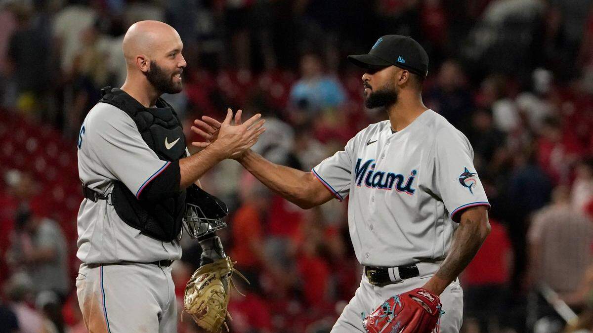 Miami Marlins starting pitcher Sandy Alcantara, right, is congratulated by teammate Jacob Stallings after getting the complete-game victory following a baseball game against the St. Louis Cardinals Wednesday, June 29, 2022, in St. Louis.