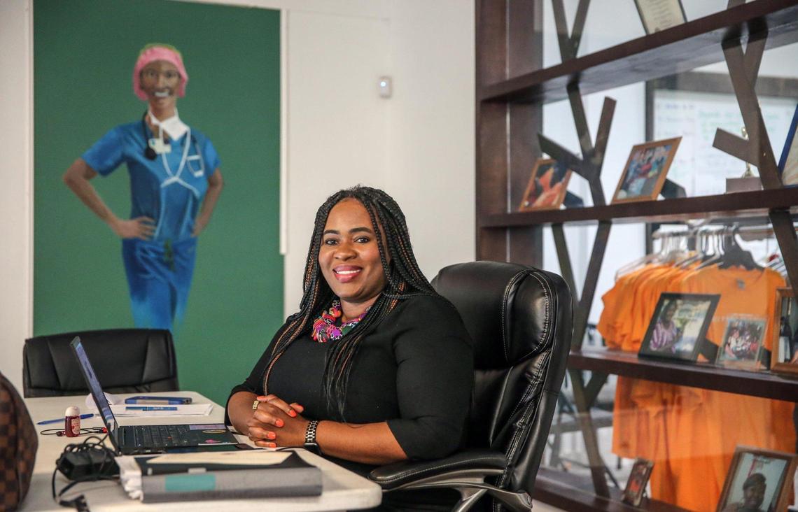 Santra Denis, the executive director for Miami Workers Center, sits inside her office near the corner of Northwest 54th Street and 7th Avenue in Miami, Florida on Wednesday, March 16, 2022. Once a commercial corridor, 7th Avenue has transformed into a hub of activism.