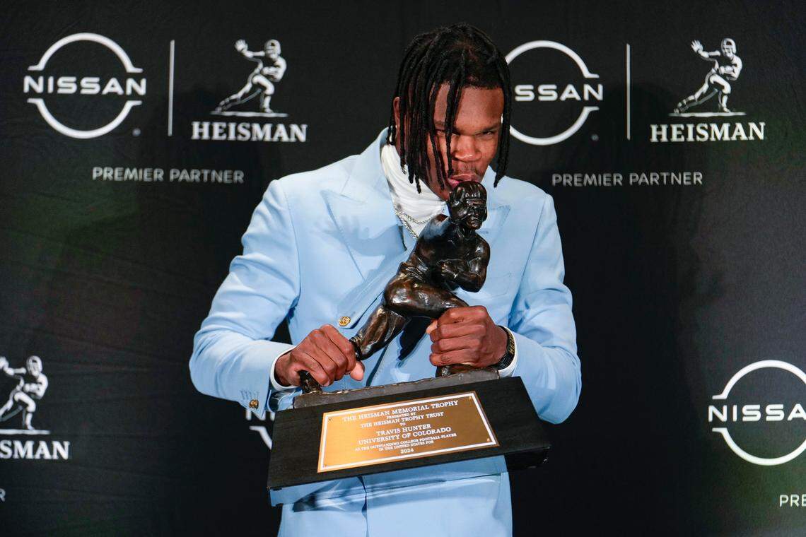 Dec 14, 2024; New York, NY, USA; Colorado Buffaloes wide receiver/cornerback Travis Hunter poses for a photo after winning the Heisman Trophy award during the 2024 Heisman Trophy Presentation.