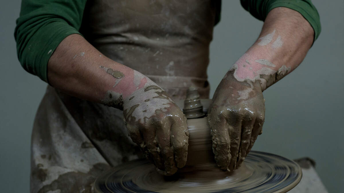 An Afghan student works on a kick wheel in the pottery studio during a class at the Turquoise Mountain Foundation in Kabul on April 29, 2012.