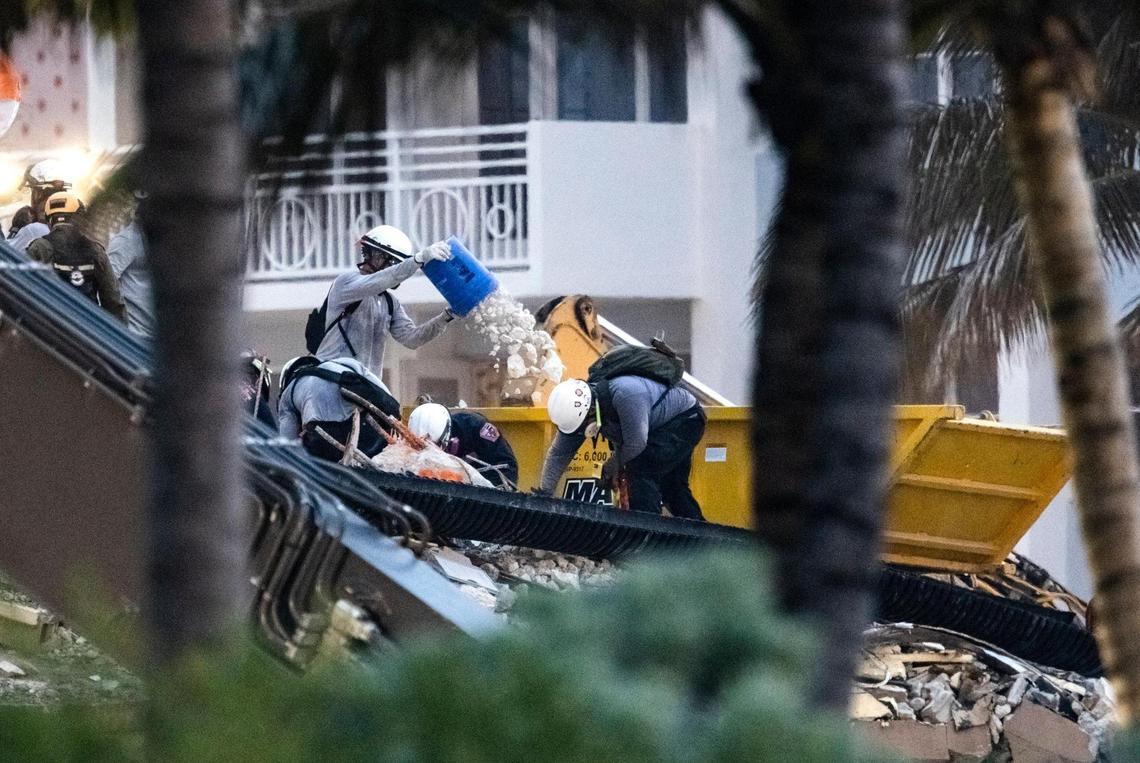 Search and rescue personnel search for survivors through the rubble at the Champlain Towers South in Surfside, Florida, Wednesday, June 30, 2021. The condo building partially collapsed on Thursday, June 24.