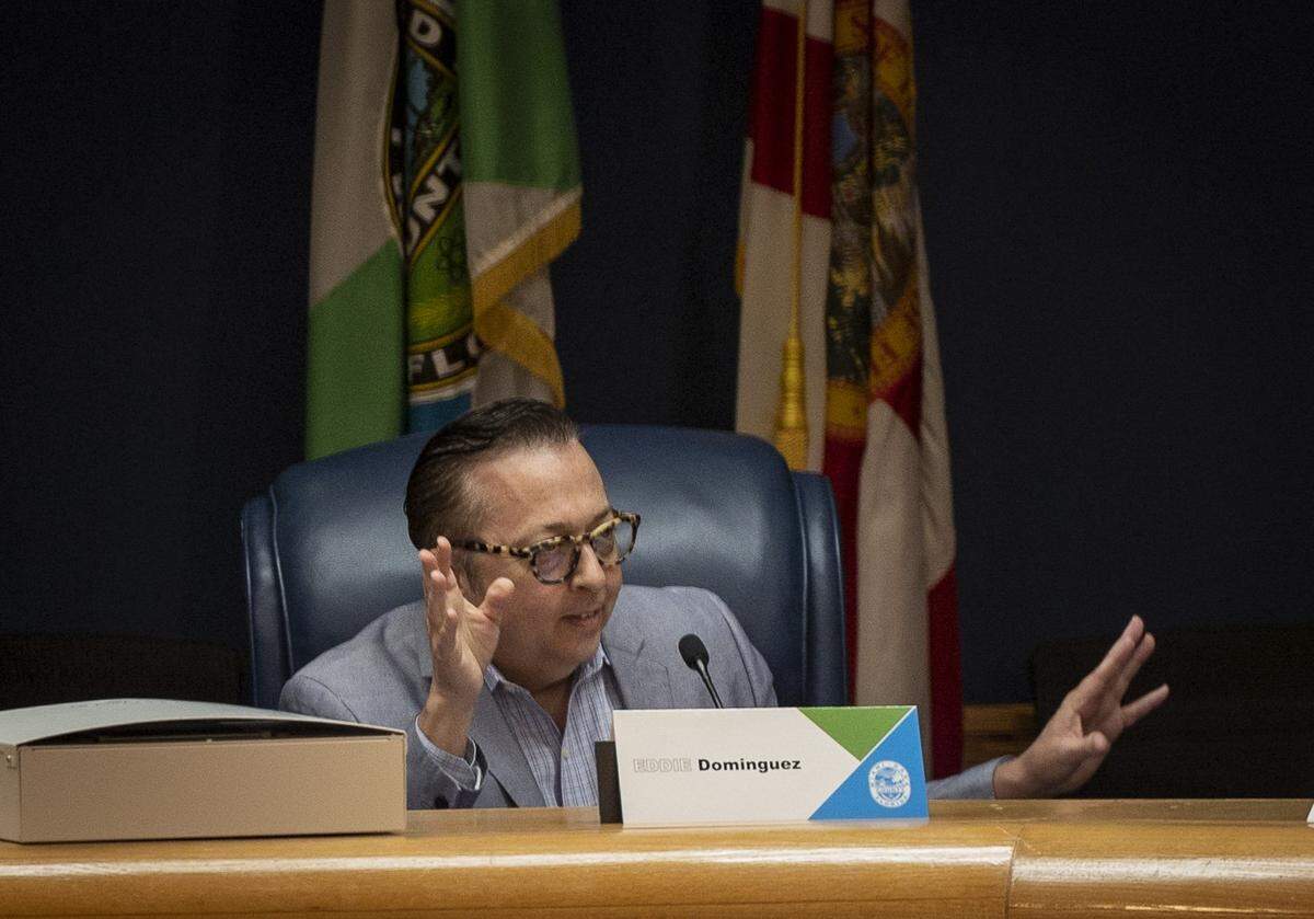 Eddie Dominguez, ICP board member, speaks during last week’s Miami-Dade County Independent Civilian Panel meeting in the commission chamber at Government Center.