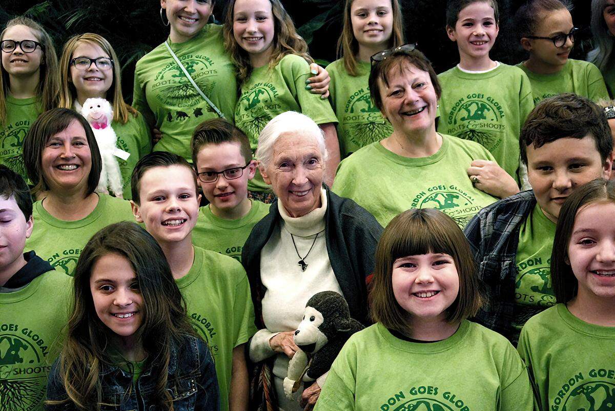 Dr. Jane Goodall poses with members of the Gordon Roots & Shoots group from Michigan during the 2019 Chicago Roots & shoots Showcase.