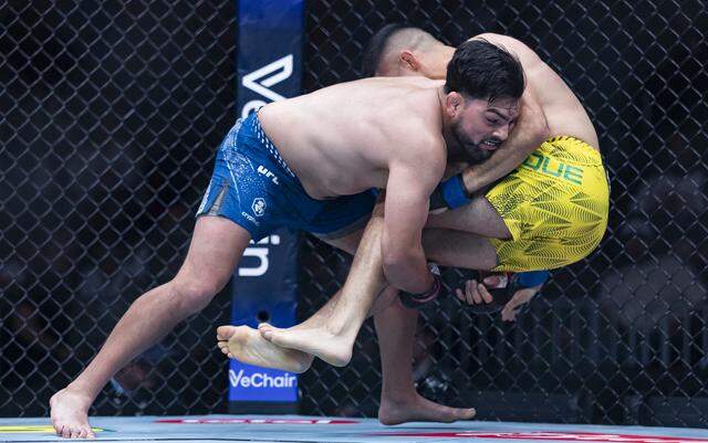 Kelvin Gastelum of the United States and Vicente Luque of Brazil fight in their middleweight bout at UFC 327 at the Kaseya Center on Saturday, April 11, 2026, in downtown Miami, Fla.