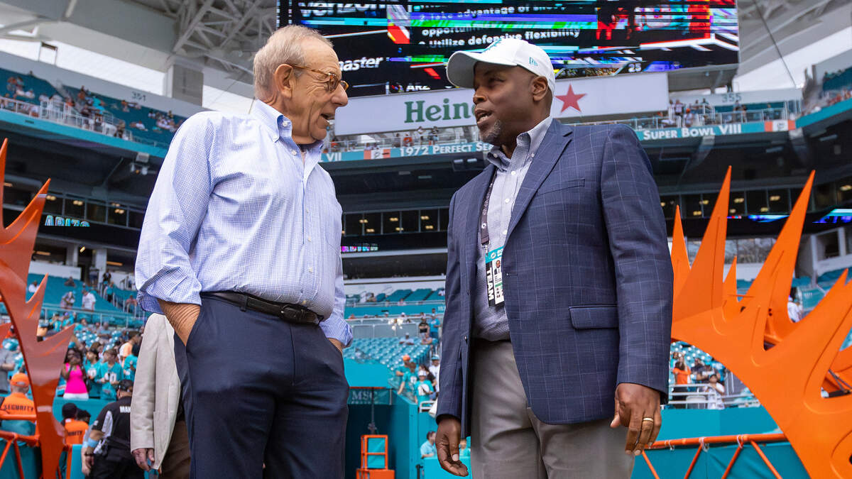 Miami Dolphins owner Stephen Ross talks with Dolphins general manager Chris Grier before the start of their NFL game against the Arizona Cardinals at Hard Rock Stadium on Sunday, Oct. 27, 2024, in Miami Gardens, Fla.