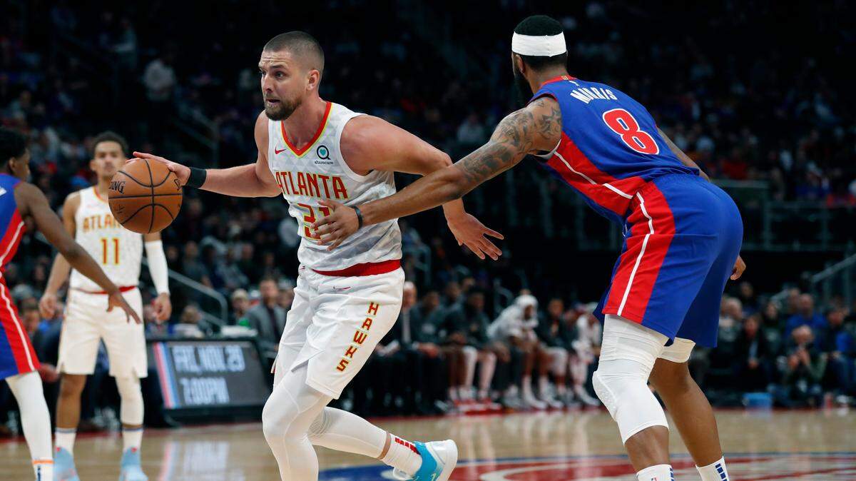Atlanta Hawks forward Chandler Parsons drives as Detroit Pistons forward Markieff Morris (8) defends during the second half of an NBA basketball game, Friday, Nov. 22, 2019, in Detroit.