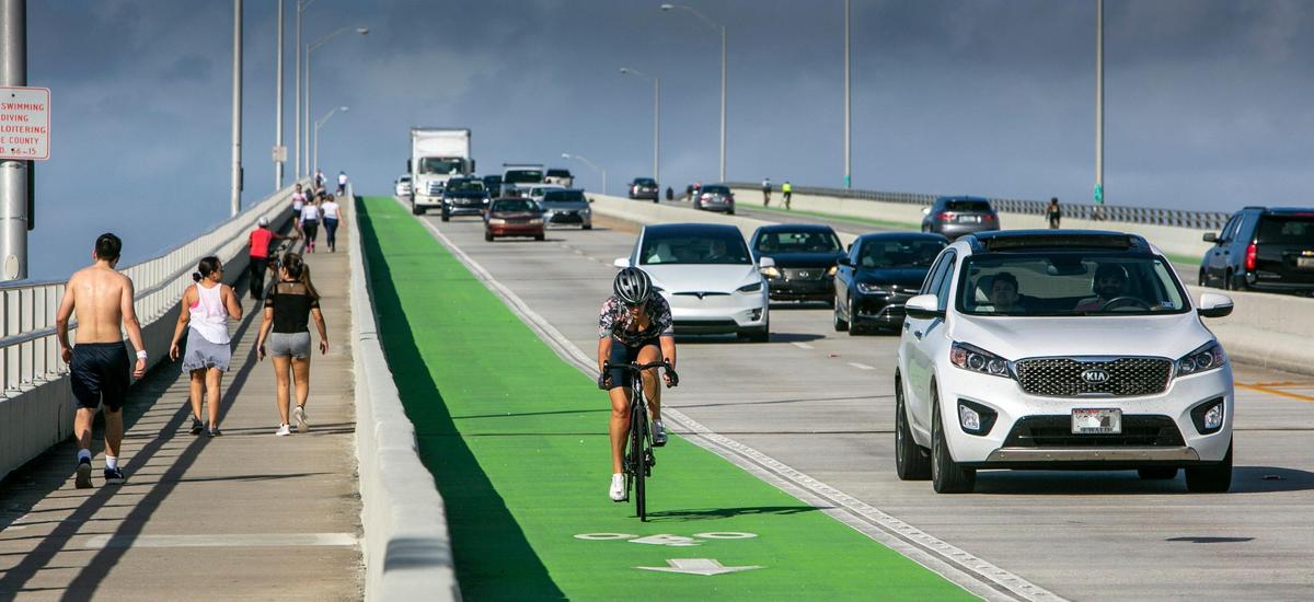 A cyclist in the bike lane coming off the William Powell Bridge. A large number of cyclists, runners and walkers have made the stretch of road between Miami and Key Biscayne a very popular recreational route with great risk for accidents.