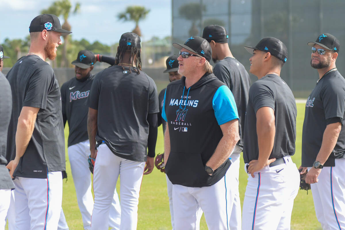 Miami Marlins pitching coach Mel Stottlemyre Jr. (center) talks with left-handed pitchers A.J. Puk (left) and Jesus Luzardo (right) during a workout at the Roger Dean Chevrolet Stadium complex in Jupiter, Florida, on Wednesday, Feb. 15, 2023.