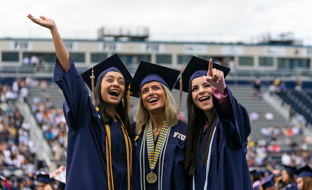 Florida International University students react during their graduation ceremony inside FIU’s Riccardo Silva Stadium in Miami, Florida on Saturday, April 30, 2022.