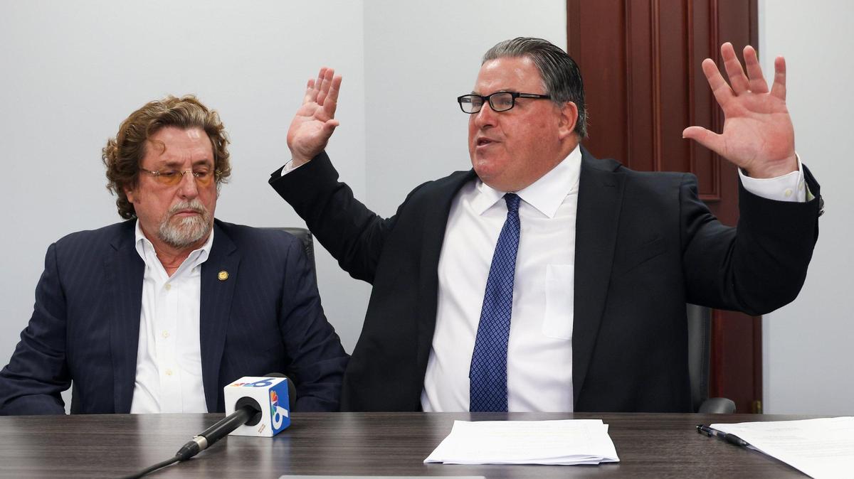 On Thursday, February 16, 2023, attorney Michael Pizzi, right, gestures as he announces filing a lawsuit to remove North Miami Beach commissioner Michael Joseph on behalf of his client, North Miami Beach commissioner Jay Chernoff, left.