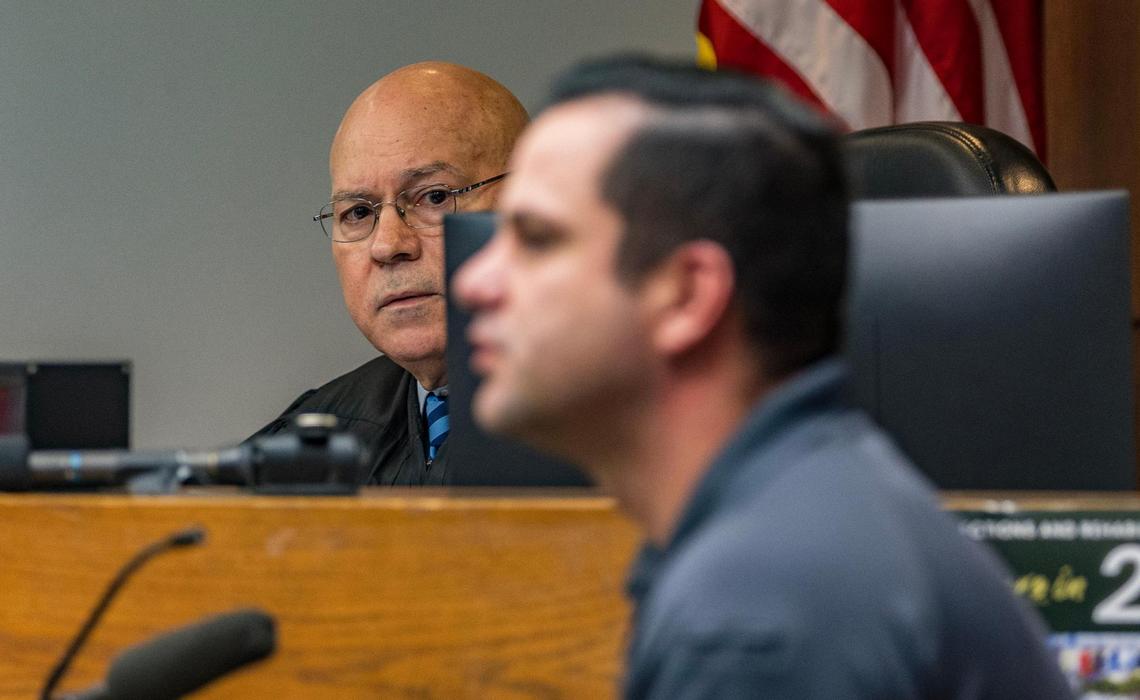 Judge Alberto Milian listens as Detective C. Ugalde gets cross-examined by a defense attorney during a pretrial hearing of defendant Oscar Olea, who has been charged with two counts of sexual battery after allegedly having an inappropriate relationship with two young girls, at the Gerstein Justice Building in Miami on Thursday, March 7, 2024.