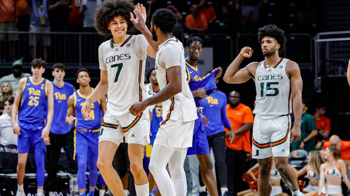 Miami Hurricanes guard Kyshawn George (7), guard Wooga Poplar (5) and forward Norchad Omier (15) celebrate as the Canes defeat Pittsburgh Panthers at the Watsco Center in Coral Gables, Florida on Saturday, January 27, 2024.