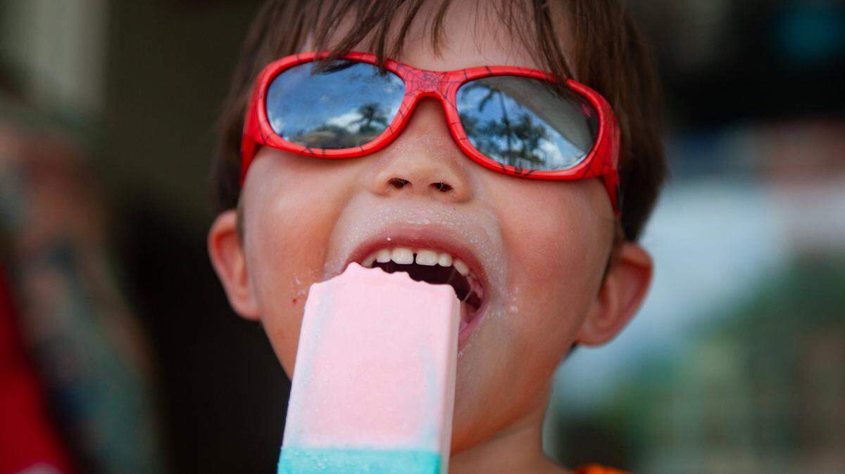 Christopher Corea, 4, eats a popsicle from South Pointe Cafe at South Pointe Park before playing in the splash pad on Wednesday, July 5, 2023 in Miami Beach, Fla.