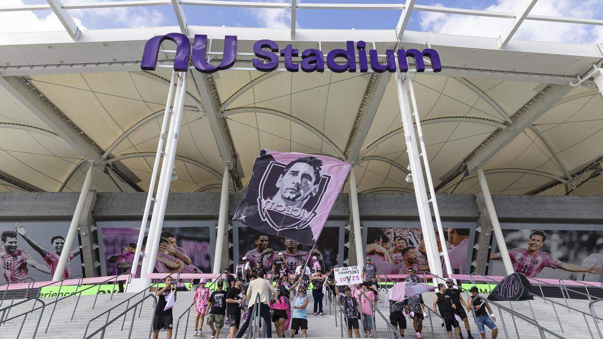Fans wave flags and cheer before a ribbon-cutting event for Nu Stadium at Miami Freedom Park ahead of an MLS match between Inter Miami CF and Austin FC on Saturday, April 4, 2026, in Miami, Fla.
