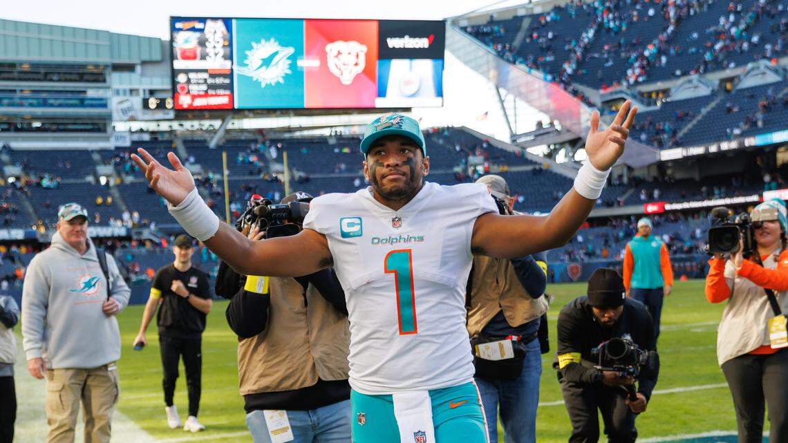 Miami Dolphins quarterback Tua Tagovailoa (1) greets the fans after their 35-32 win over the Chicago Bears during first quarter of an NFL football game at Soldier Field on Sunday, November 6, 2022 in Chicago, Illinois.