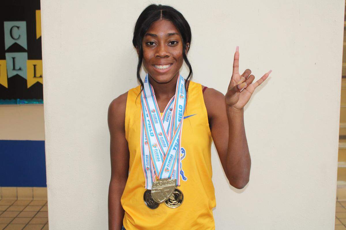 Aaliyah Butler, Northwestern High, flashing bull sign in 2022.