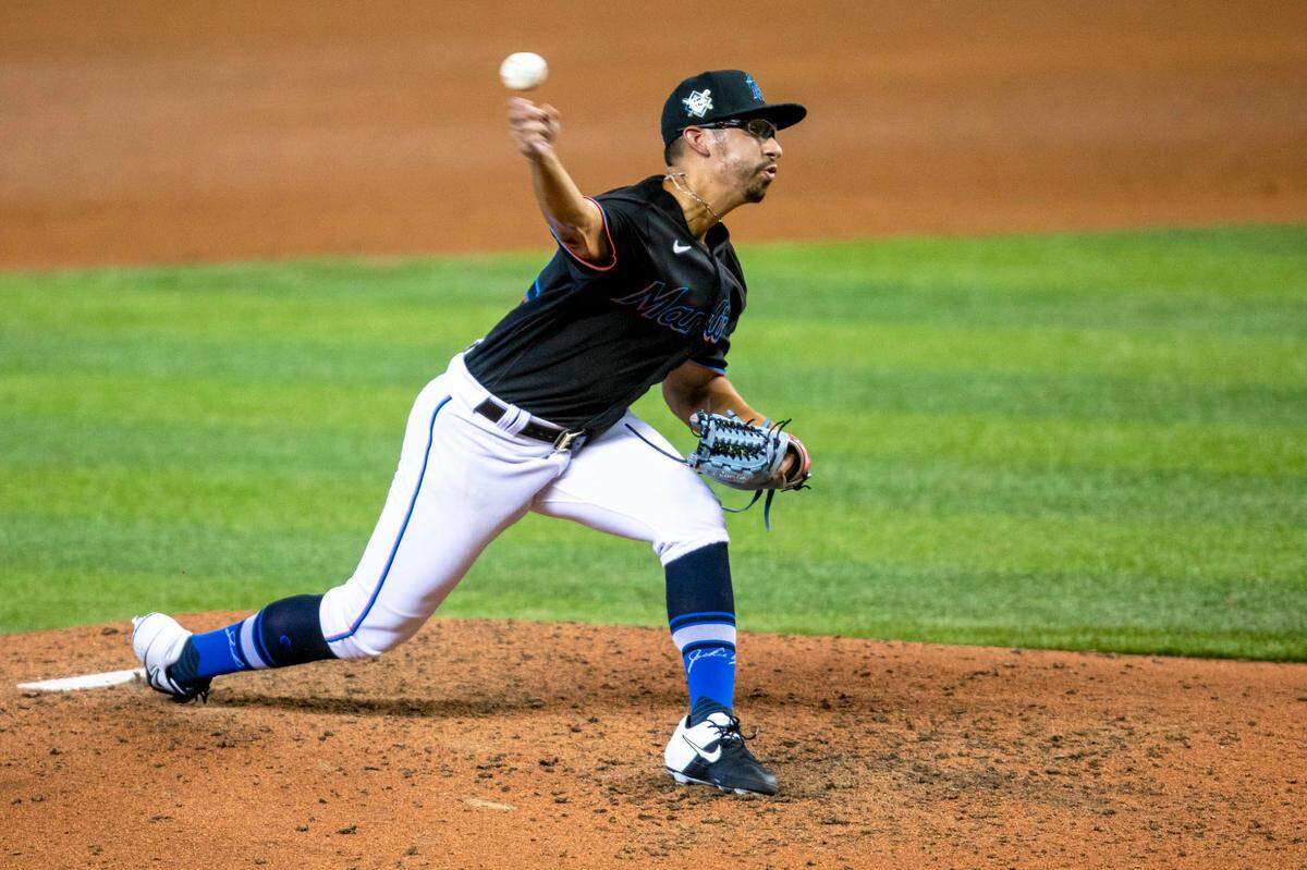 Miami Marlins right-handed pitcher Robert Dugger (42) throws a pitch during the fifth inning of a Major League Baseball game against the Tampa Bay Rays at Marlins Park in Miami, Florida on Sunday, August 30, 2020.