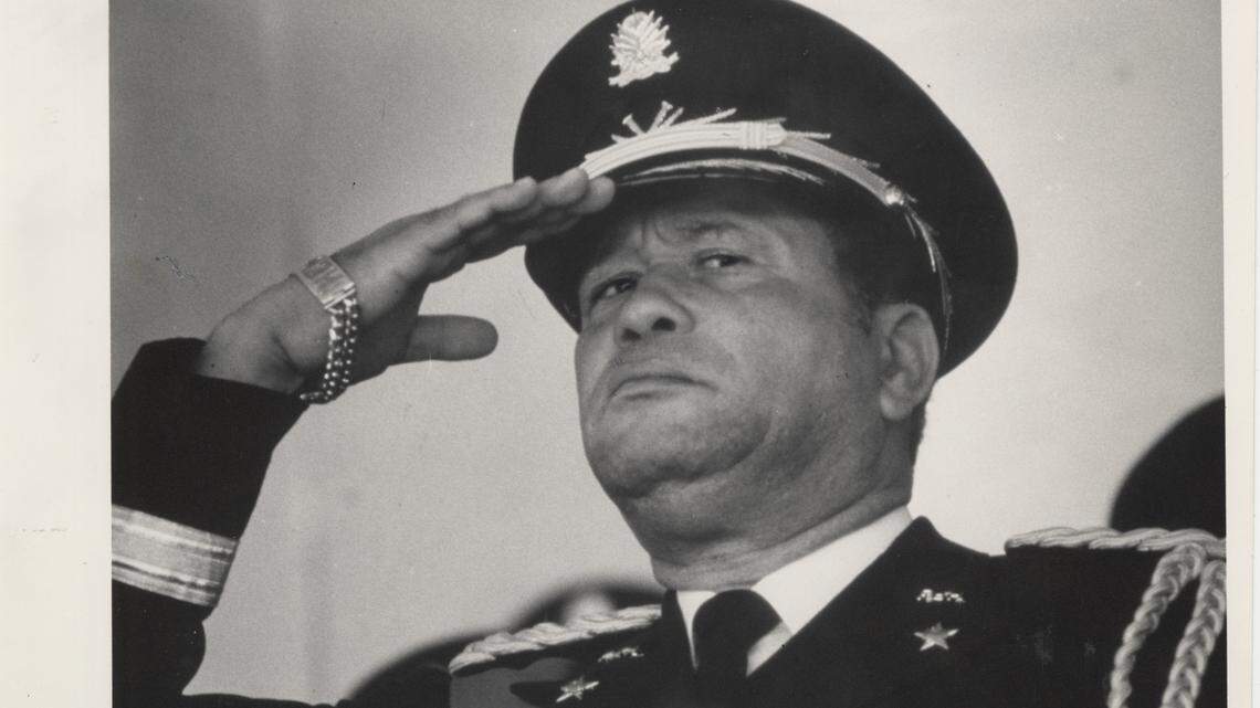 General Henri Namphy at "Army Day" celebration week before the election planned for Nov. 29, 1987. That election was disrupted by gunmen who roamed the country shooting up polling places, burning electoral offices and scattering new ballots. Namphy had led the military provisional junta that took over from the Duvalier family and ruled Haiti for two years.