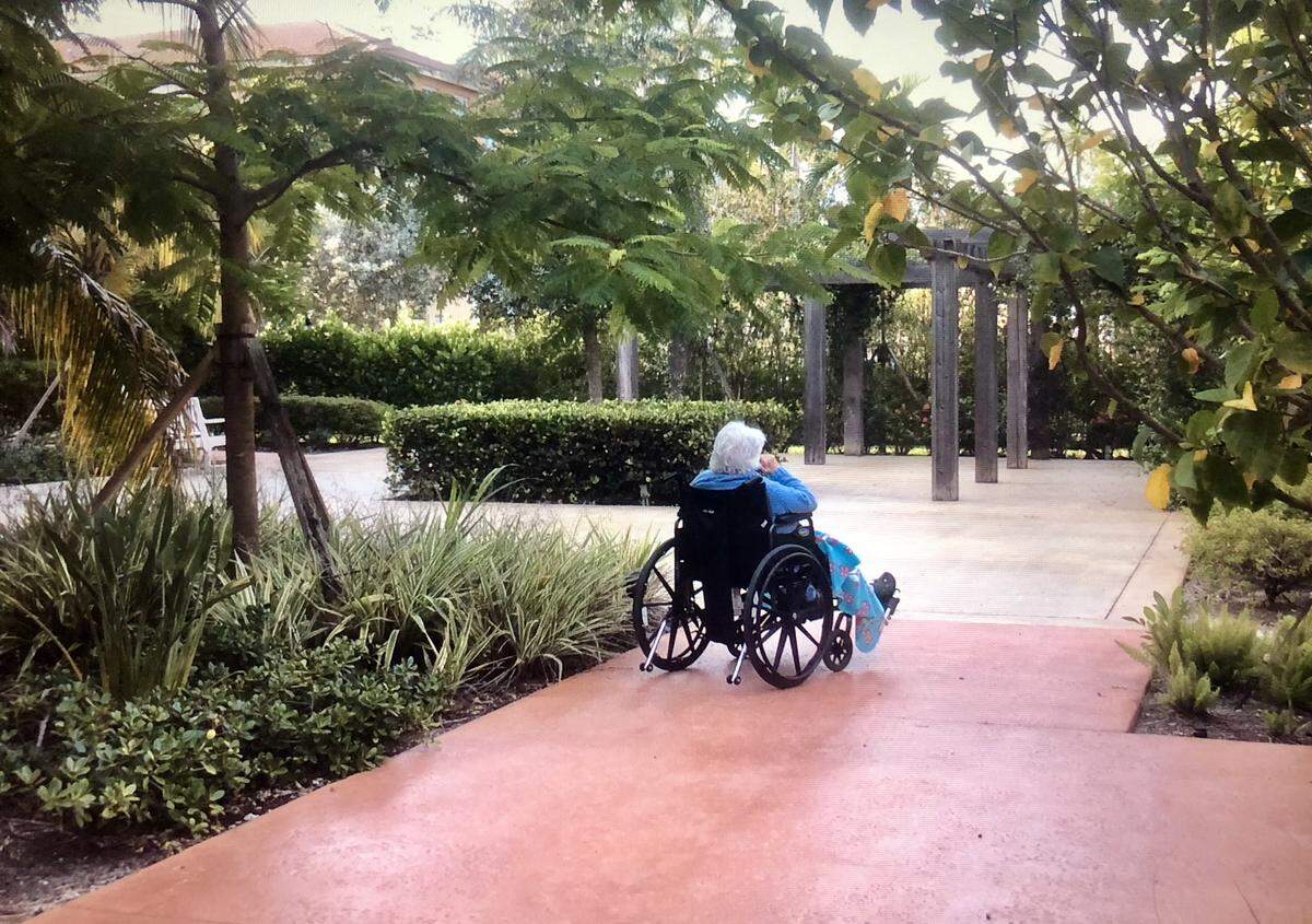 In the long goodbye of Alzheimer’s, every Mother’s Day is another moment to treasure. The writer’s mother in the garden she loves.