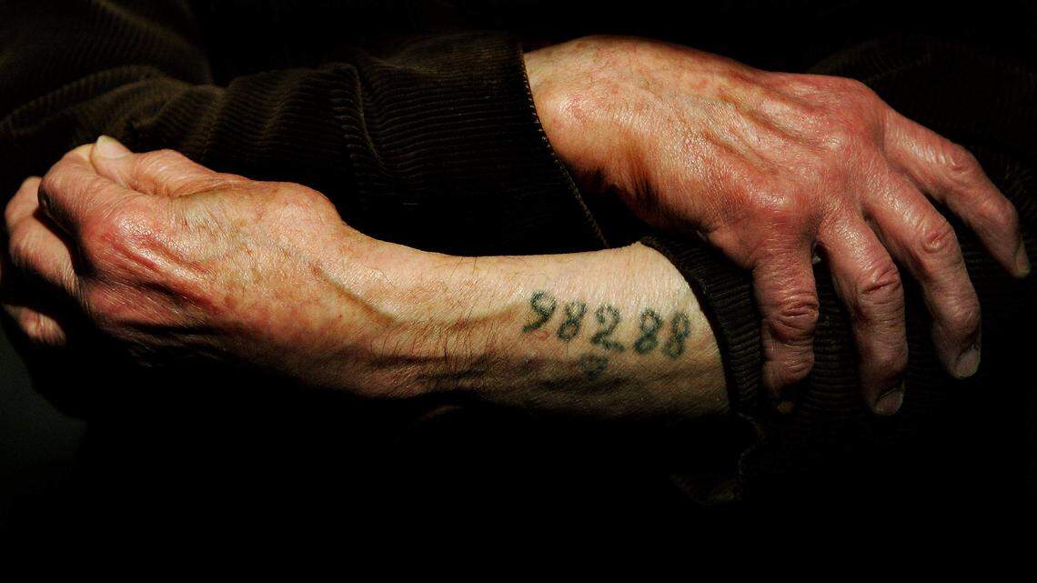 The tattoo on the arm of a Holocaust survivor bears witness to the World War II atrocity.