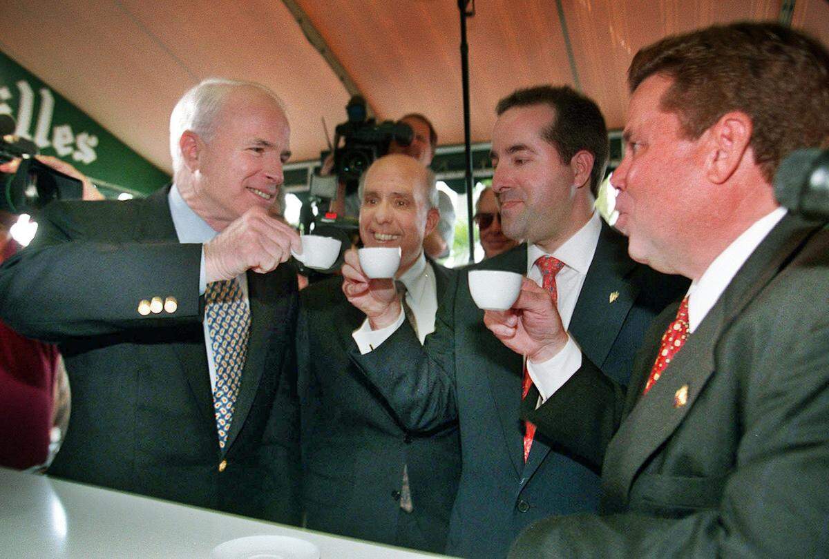 Presidential Candidate Sen. John McCain sips Cuban coffee at Versailles Restaurant in Little Havana with (left to right) Alberto Hernandez, president of the Cuban American National Foundation; Jorge Mas Santos, Chairman of the Cuban American National Foundation; and Juan Montes.