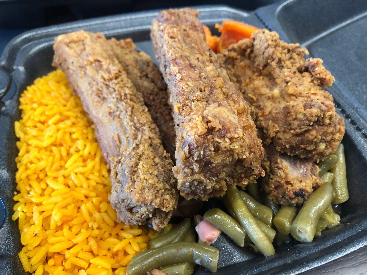 Fried pork rib “Take it to the House” platter at Sunday’s Eatery in Miami Gardens.
