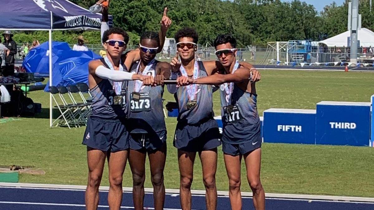 Two-time defending state champion Columbus finished eighth overall, but secured one championship from its 3,200 relay team, above. Seniors Adrian Bichara, Malcolm Brown, Alvaro Canarte and Christian Ivonnet ran a winning time of 7:51.52.