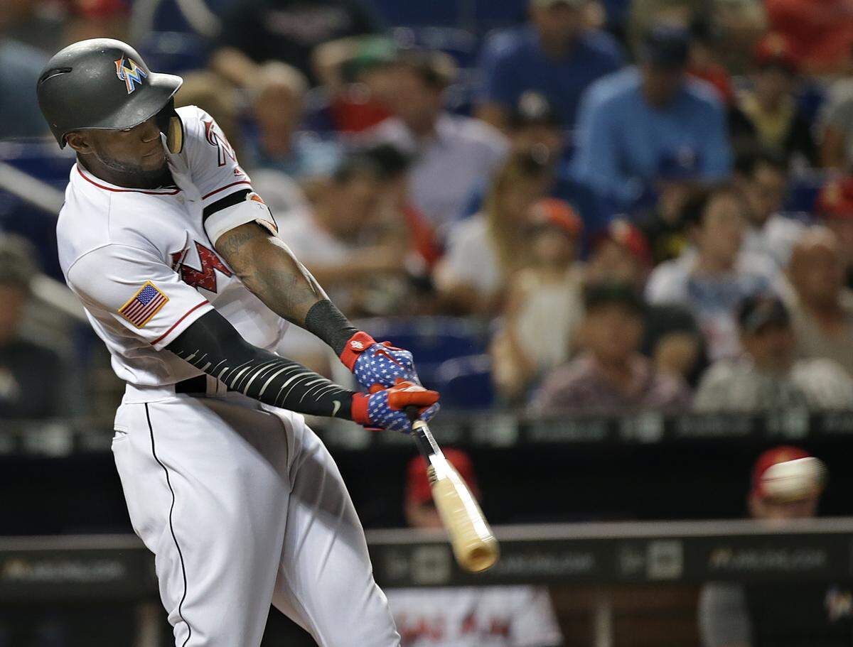 Marlins outfielder Cameron Maybin hits a single in the third inning of the Miami Marlins vs. Tampa Bay Rays game at Marlins Park  on July 04, 2018.