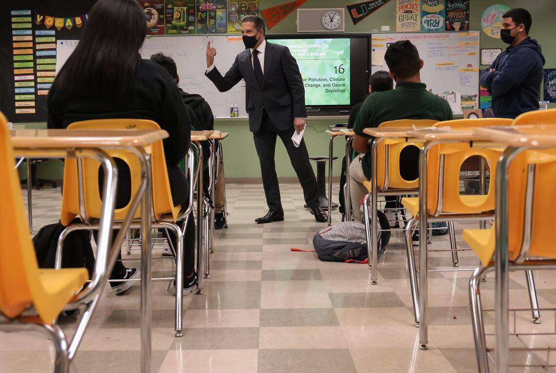 Superintendent Alberto Carvalho, center, subs-in during 9th grade environmental science class at Miami Jackson Senior High where he started his career in education, in response to teacher shortage due teachers taking sick days or high cases of COVID-19 on Tuesday, January 4, 2022 in Miami, Florida.