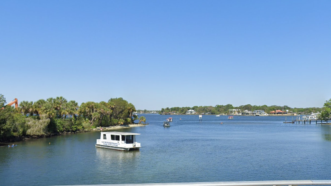 The suspects crashed a car into woods near Crystal River, Florida. They were found hiding under a dock, officials say.