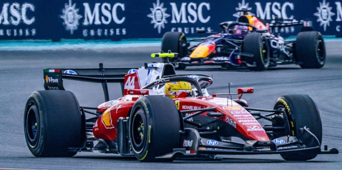 Lewis Hamilton of Great Britain and driver of the (44) Scuderia Ferrari HP race car leads Max Verstappen of the Netherlands and driver of the (3) Oracle Red Bull Racing race car in Turn6 in the Sprint Race on the second day of the Formula One Miami Grand Prix at the Miami International Autodrome on Saturday, May 2, 2026, in Miami Gardens, Fla.