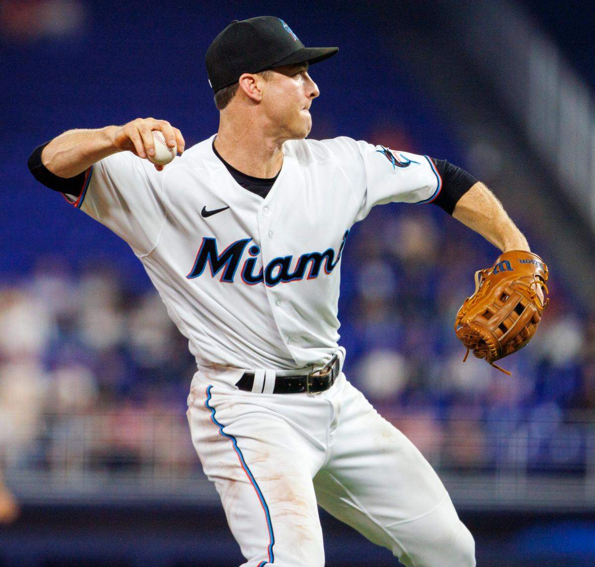 Miami Marlins third baseman Joey Wendle (18) throws to first base to put out St. Louis Cardinals second baseman Tommy Edman (19) during the second inning of the baseball game at LoanDepot Park on Tuesday, April 19, 2022 in Miami, Florida.