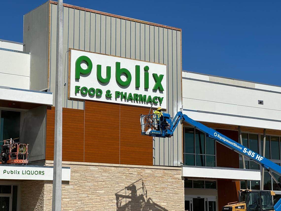 Construction crews work on the storefront of a new build Publix set to replace an old store at the Briar Bay Shopping Plaza across the street from The Falls in South Miami-Dade on Nov. 1, 2024. The mall anchor store, which will be two stories and about 53,000 square feet, is at 13005 SW 89th Place.