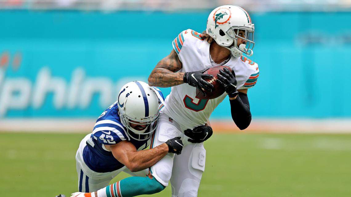 Miami Dolphins wide receiver Will Fuller (3) runs with the ball againstIndianapolis Colts defensive back Rolan Milligan (42) during first quarter of an NFL football game at Hard Rock Stadium on Sunday, October 3, 2021 in Miami Gardens, Florida.