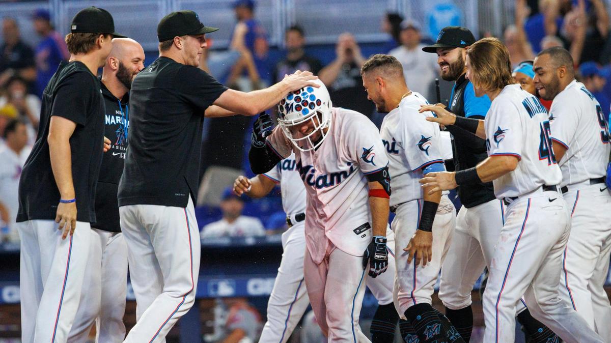 Miami Marlins catcher Nick Fortes (54) celebrate with teammates after hitting a walk off solo home run during the ninth inning of a baseball game against the New York Mets at LoanDepot Park on Sunday, June 26, 2022 in Miami, Florida.