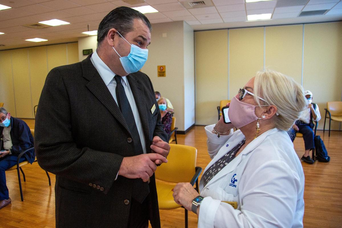 Maureen De Soria, right, VP of medical operations at Leon Medical Centers, talks to Jose Rodriguez, administrator for the West Hialeah Center, inside a COVID-19 vaccination room at Leon Medical Centers - Flagler on 7950 NW 2nd Street in Miami, Florida, on Thursday, January 7, 2021.