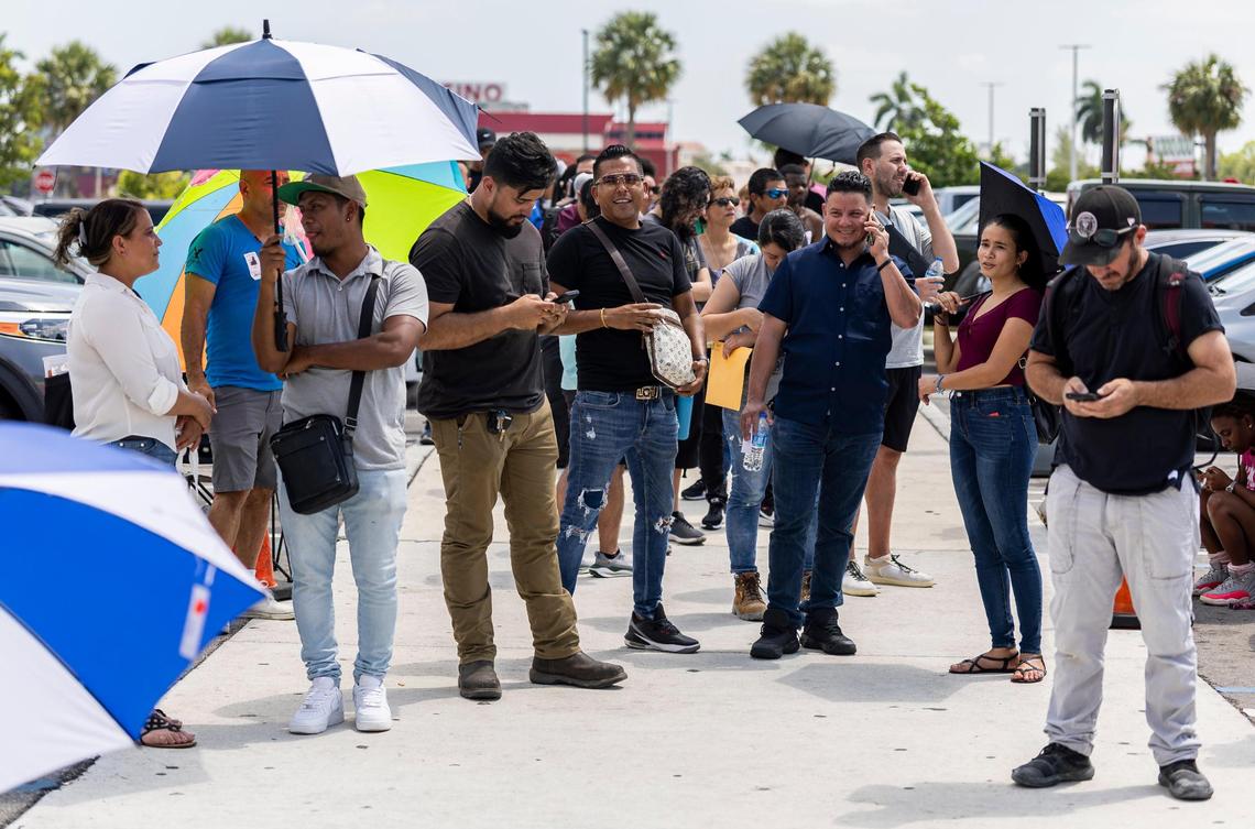 People who arrived without appointments wait in line outside a Florida Highway Safety and Motor Vehicles Driver License and Motor Vehicle Service Center on April 16, 2025, in Miami, Fla. Upgraded equipment at the Midway Crossings mall location at 7795 W. Flagler St. may help, according to its new operator, Miami-Dade Tax Collector’s Office.