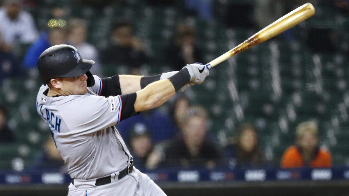 Miami Marlins’ Chad Wallach hits an RBI double in the 11th inning of the team’s baseball game against the Detroit Tigers in Detroit, Tuesday, May 21, 2019. (AP Photo/Paul Sancya)